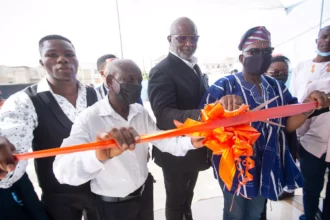 QNET officials cutting the ribbon at the opening of the Training Center in Ghana
