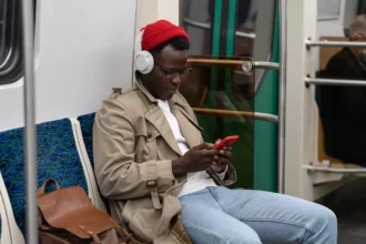 African man listening to QBUZZ's audio posts