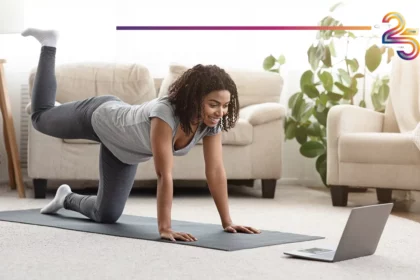 African lady doing exercice in front of her computer
