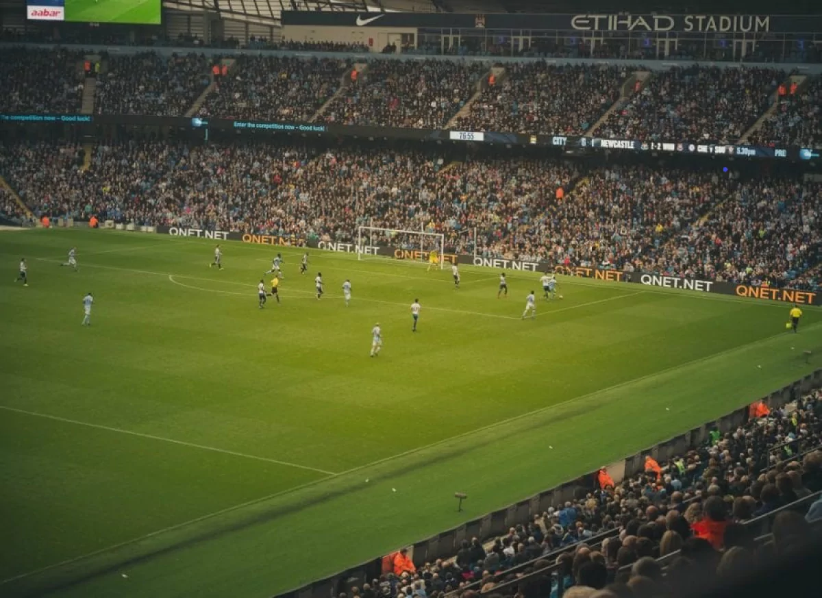 QNET's logo at Manchester City's Etihad Stadium