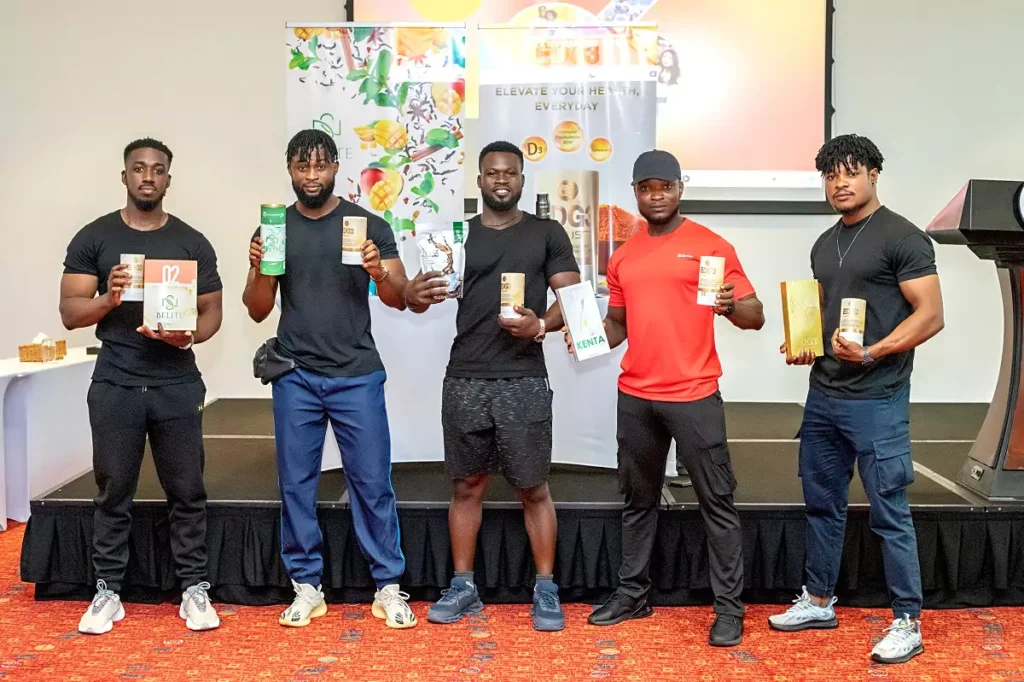 Fitness coaches holding QNET products in Accra, Ghana