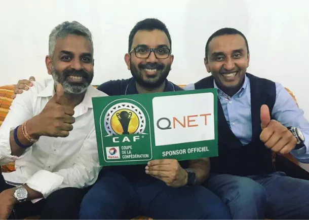 QNET's V Ambassadors posing with a QNET-CAF sign